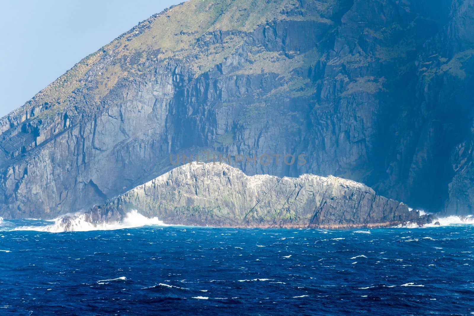 Rocky cliffs give place for flocks of seabirds at Cape Horn on Hornos Island in Chile