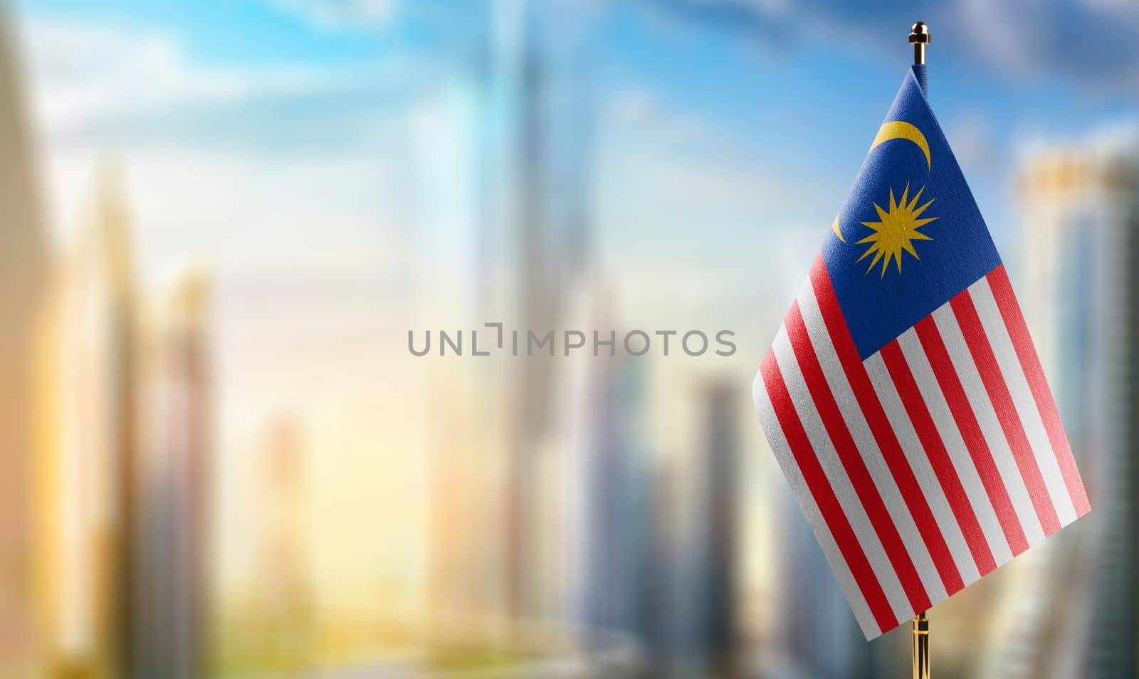 Small flags of the Malaysia on an abstract blurry background by butenkow