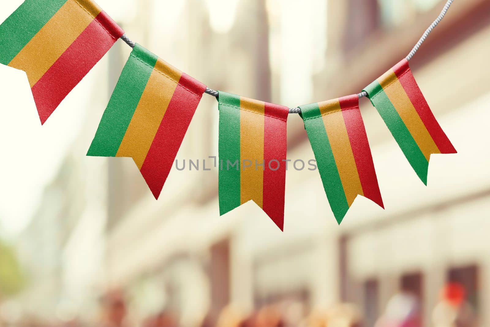 A garland of Bolivia national flags on an abstract blurred background.