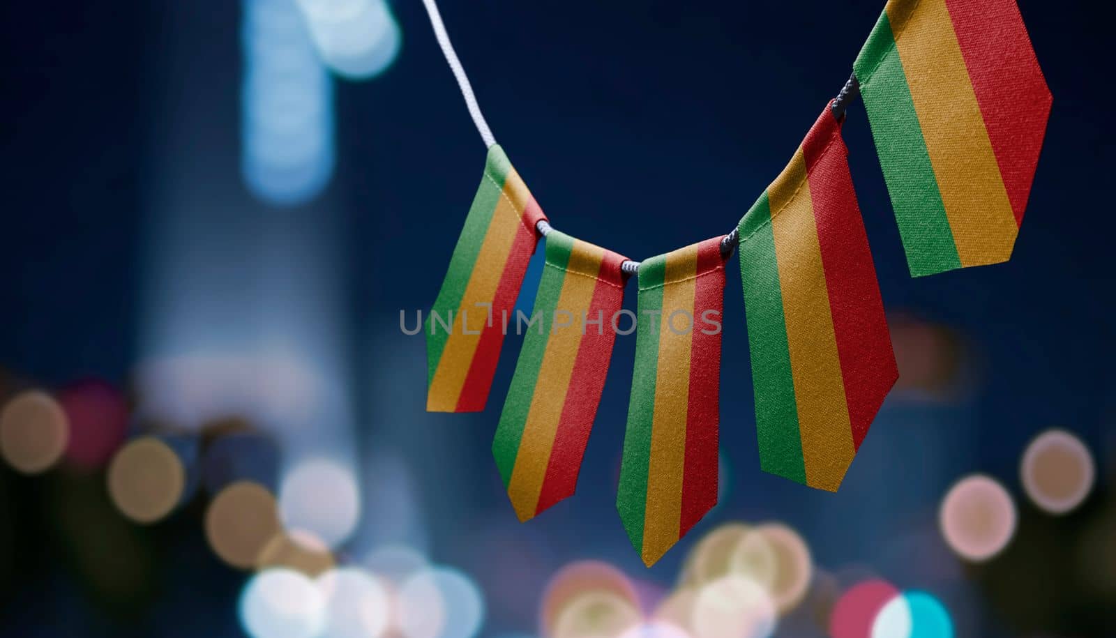 A garland of Bolivia national flags on an abstract blurred background.