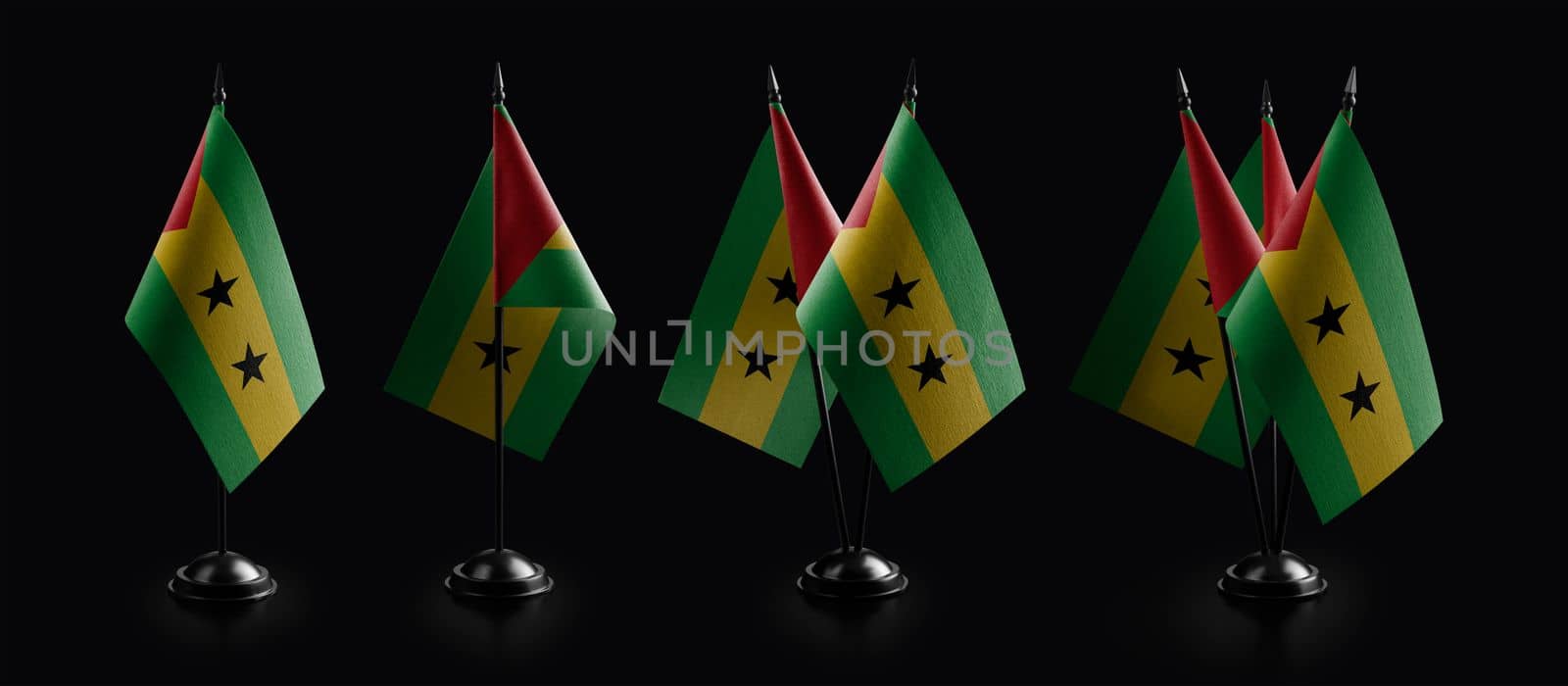 Small national flags of the Sao Tome and Principe on a black background by butenkow