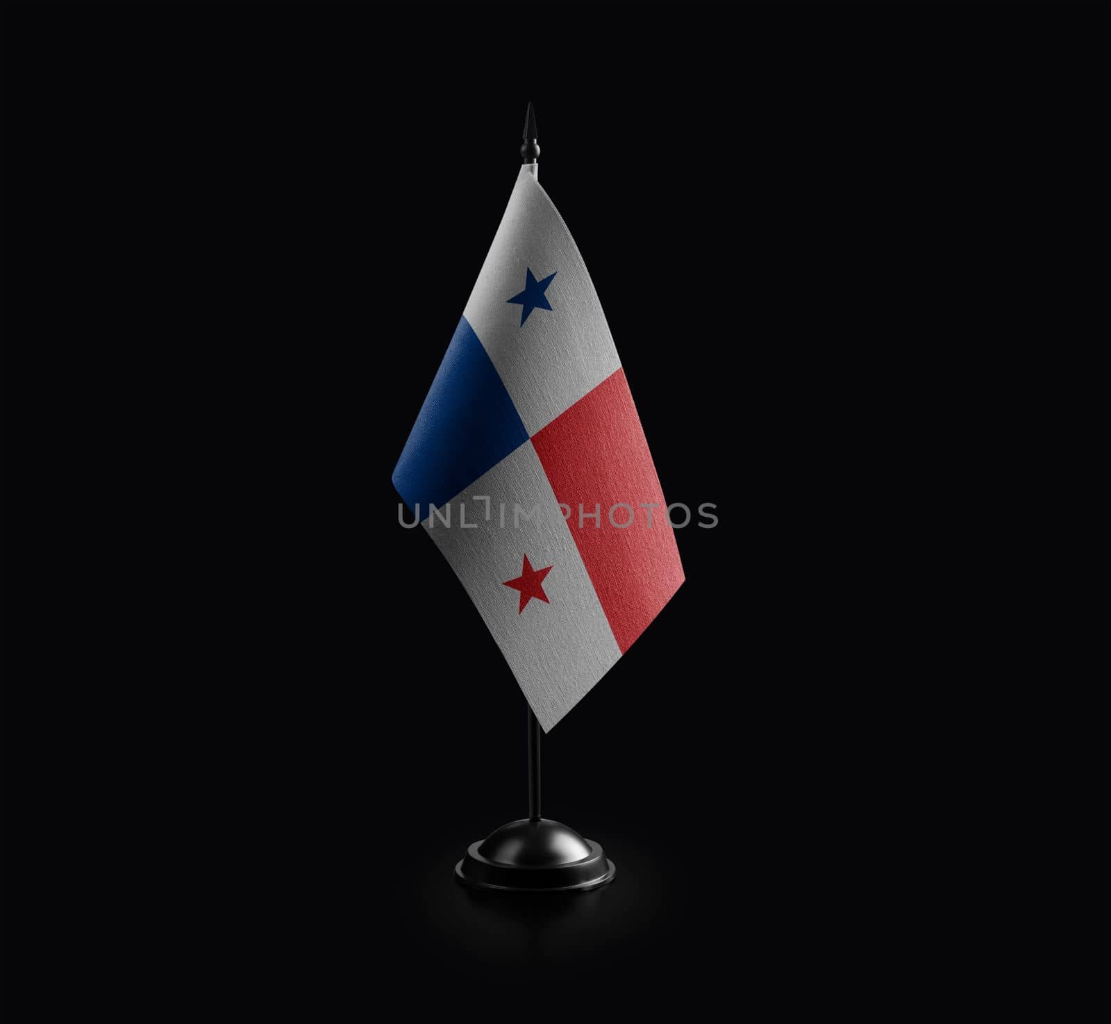 Small national flag of the Panama on a black background.