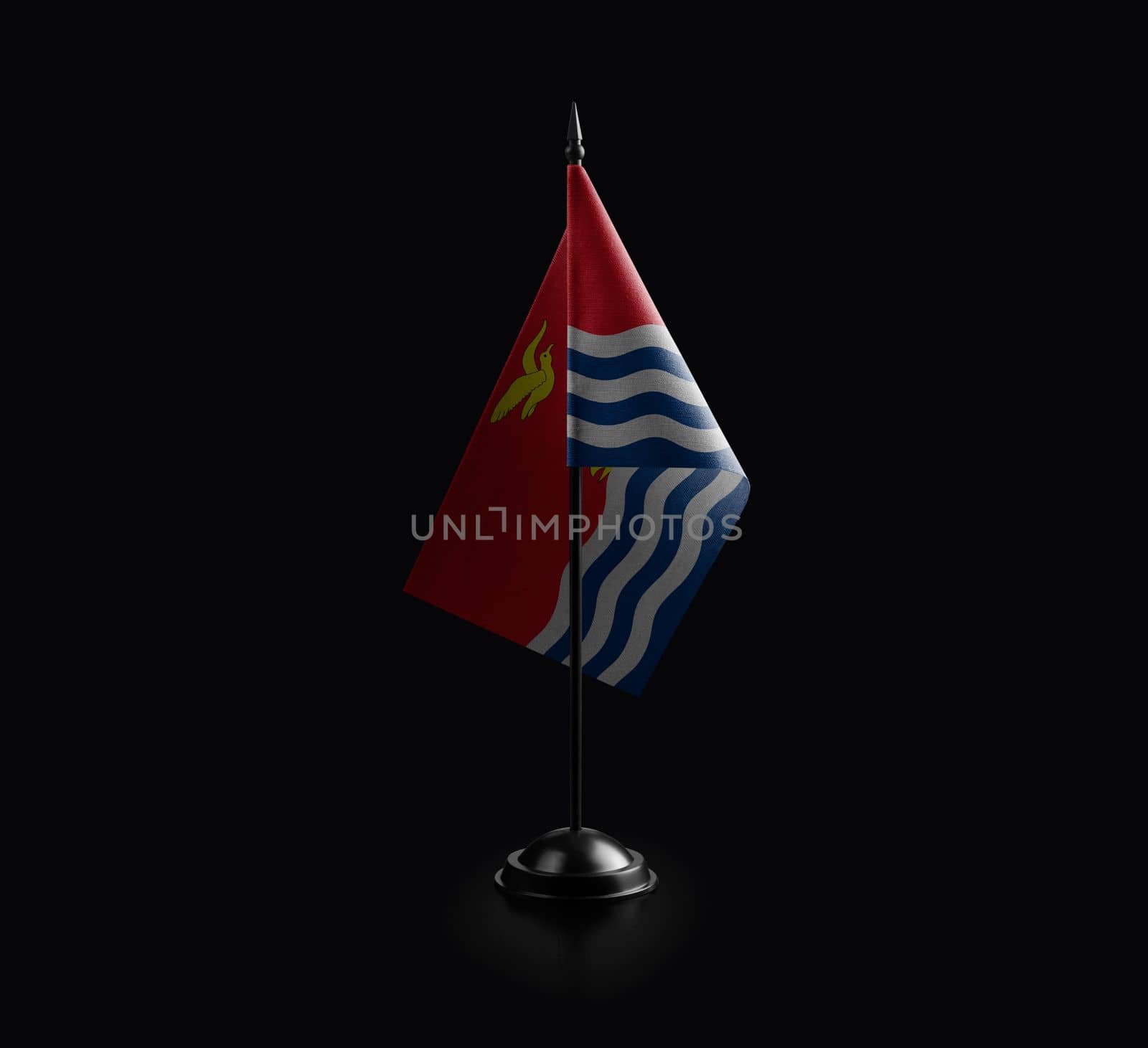 Small national flag of the Kiribati on a black background by butenkow