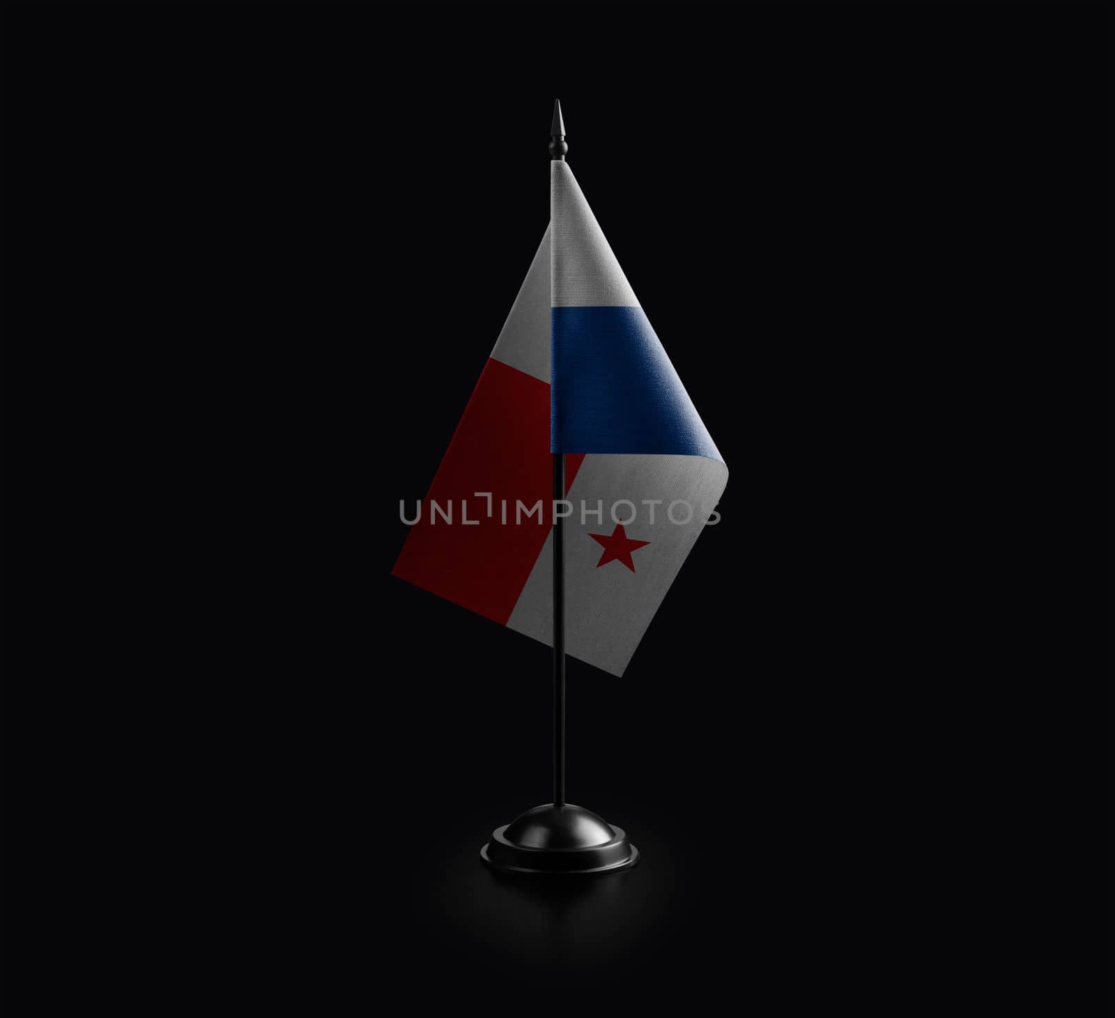 Small national flag of the Panama on a black background.