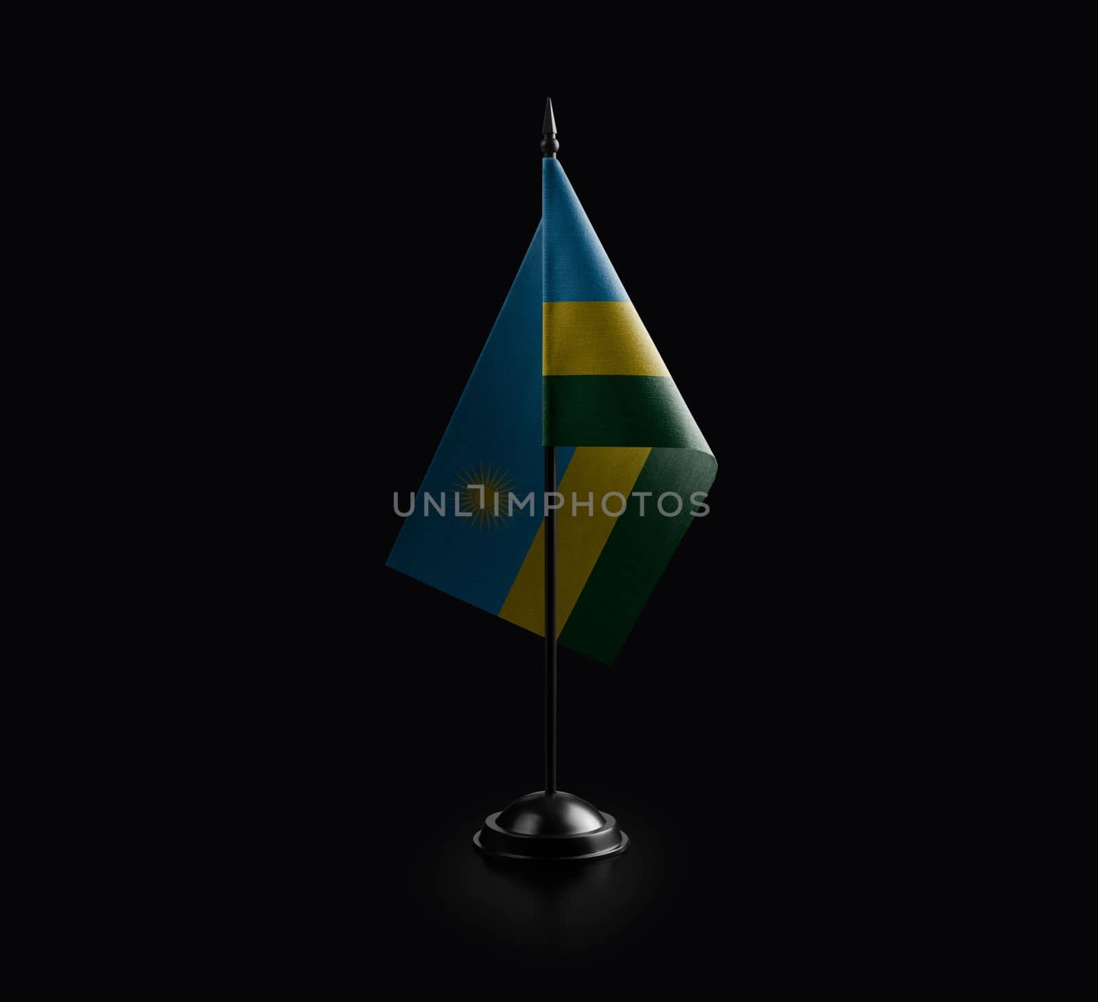 Small national flag of the Rwanda on a black background.