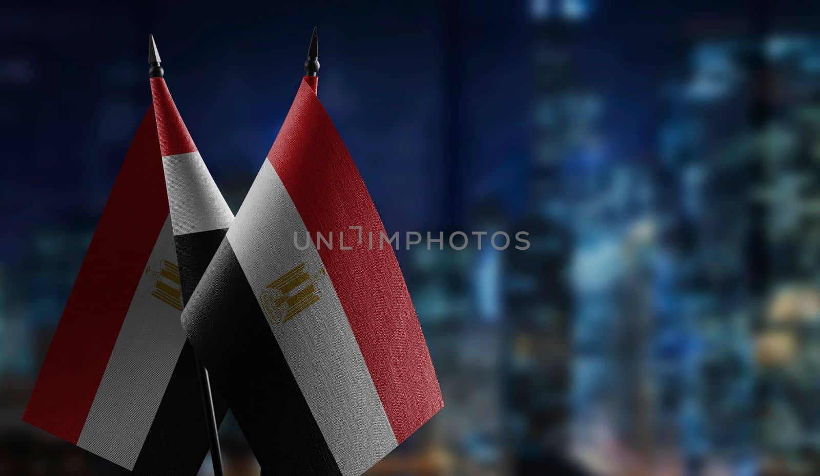 A small Egypt flag on an abstract blurry background.