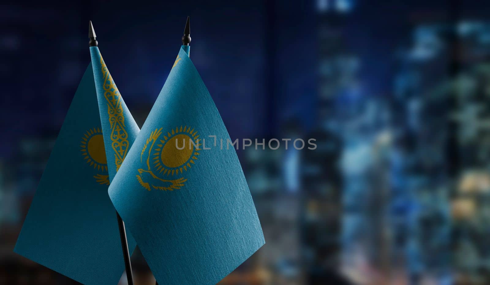 A small Kazakhstan flag on an abstract blurry background.