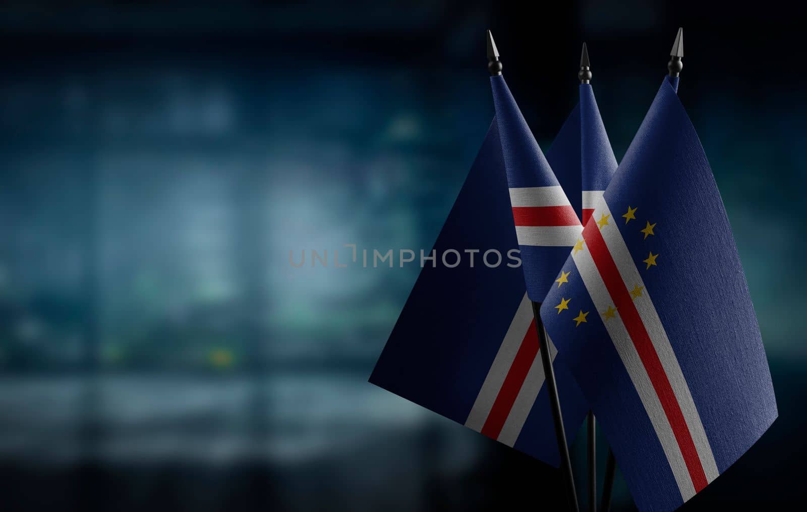 Small flags of the Cape Verde on an abstract blurry background by butenkow