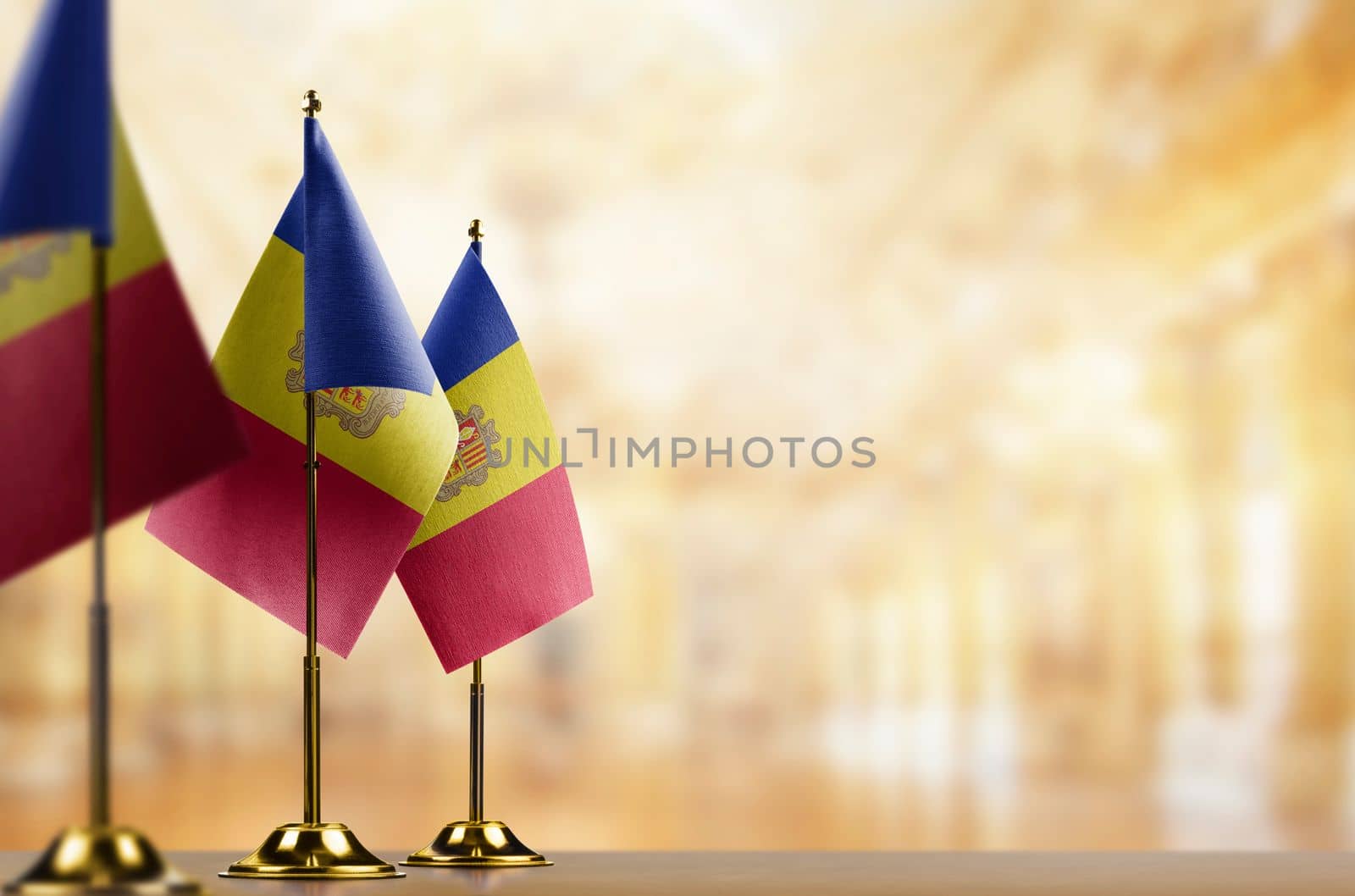 A small Andorra flag on an abstract blurry background by butenkow