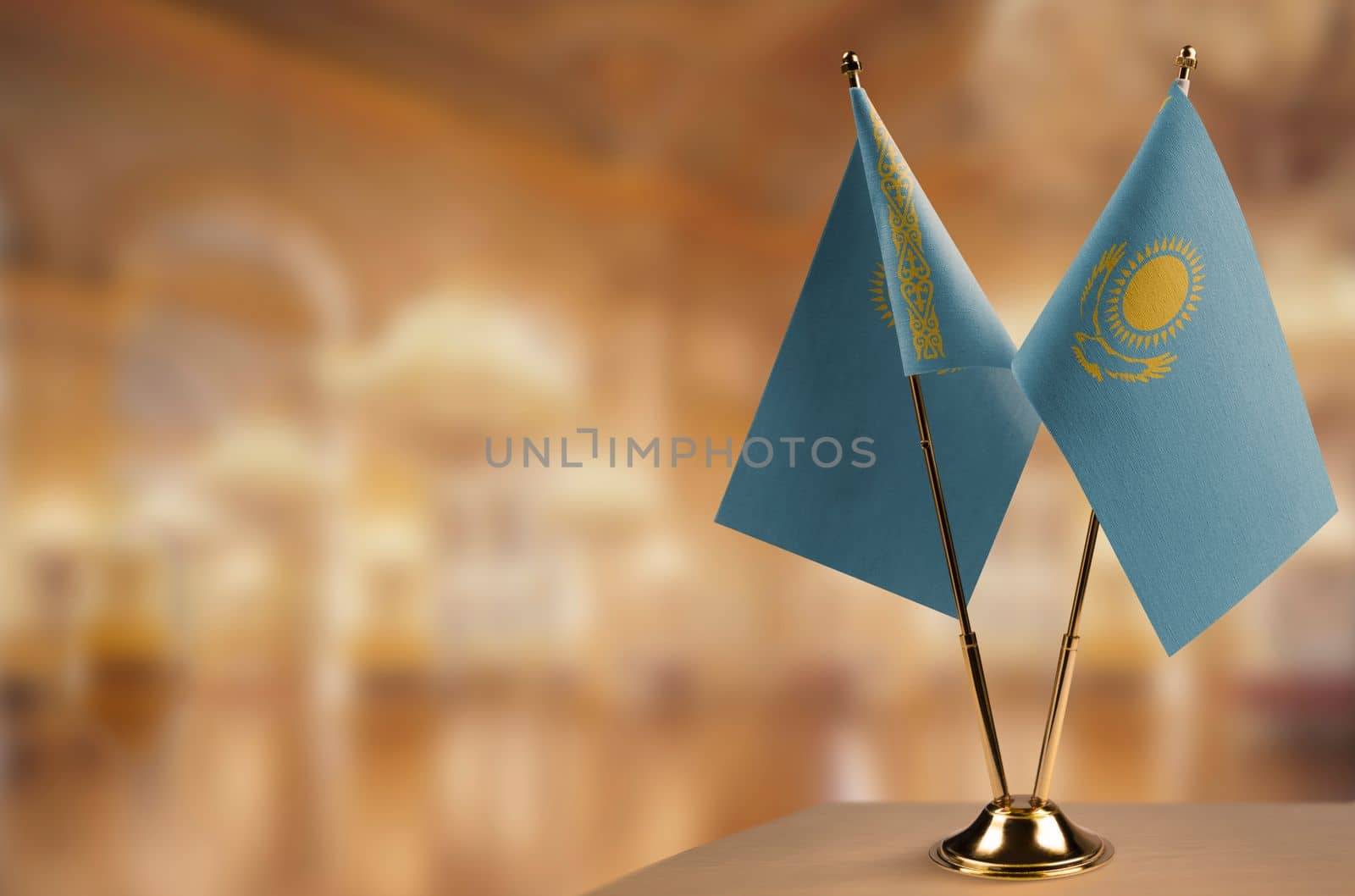 A small Kazakhstan flag on an abstract blurry background by butenkow