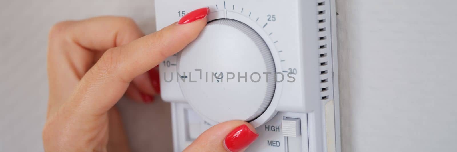 Manually adjust temperature in central heating control panel. Temperature control system concept
