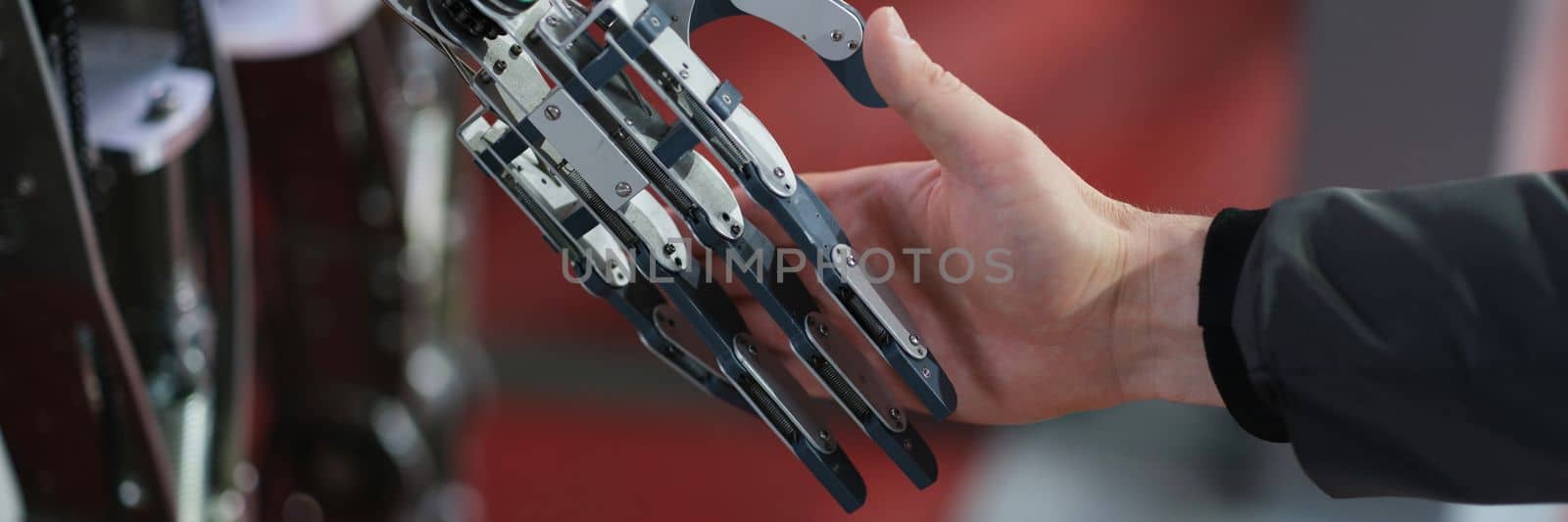 Robot extends its hand to woman for handshake. Artificial intelligence concept business design