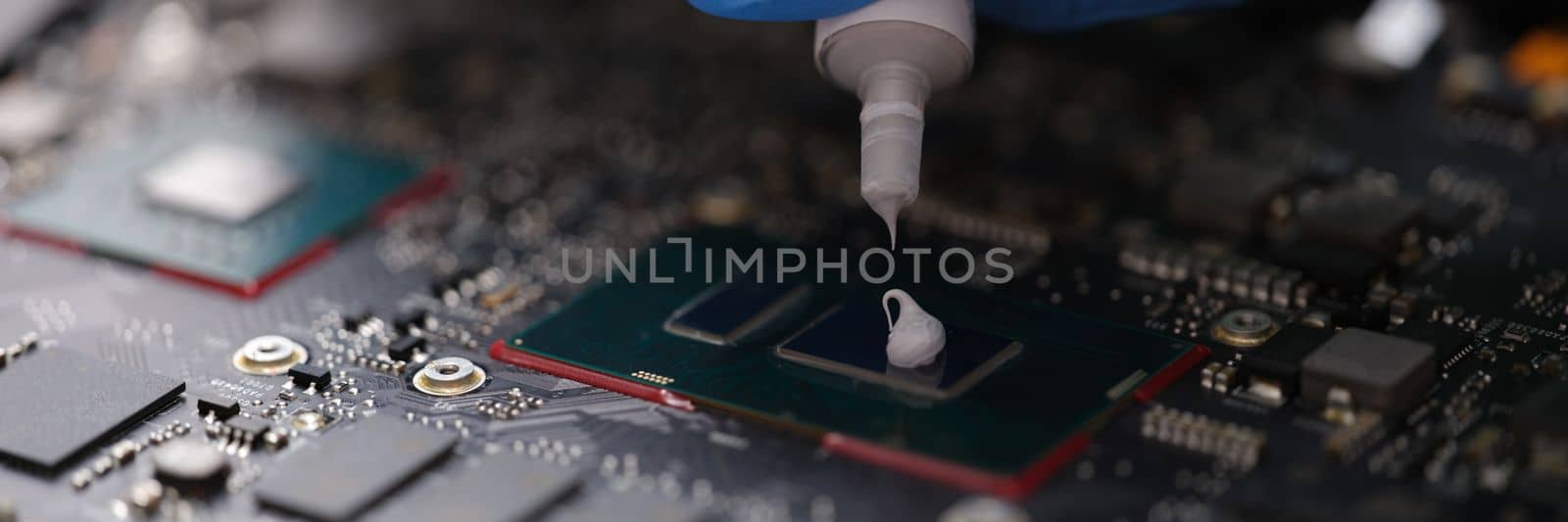 Thermal paste on computer processor chip closeup by kuprevich