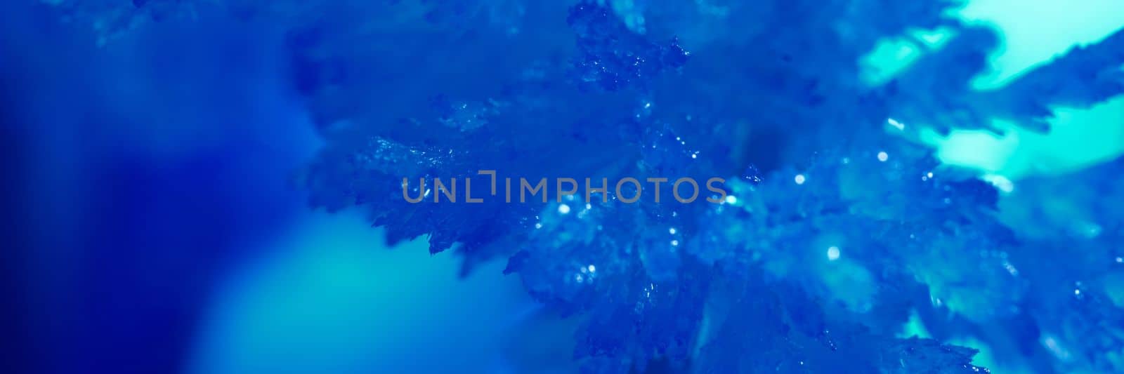 Christmas ornament dark blue ice window decoration wallpaper. Frozen ice icicles macro