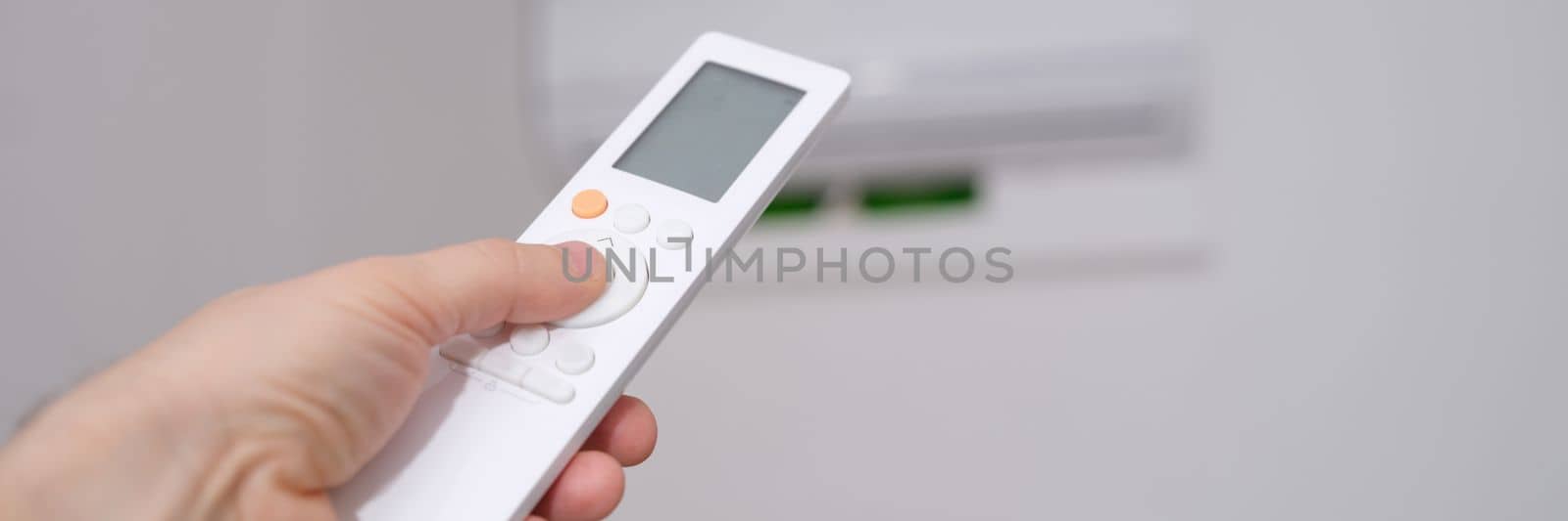 Operation of air conditioner from remote control in hand. Universal remote control for climate control