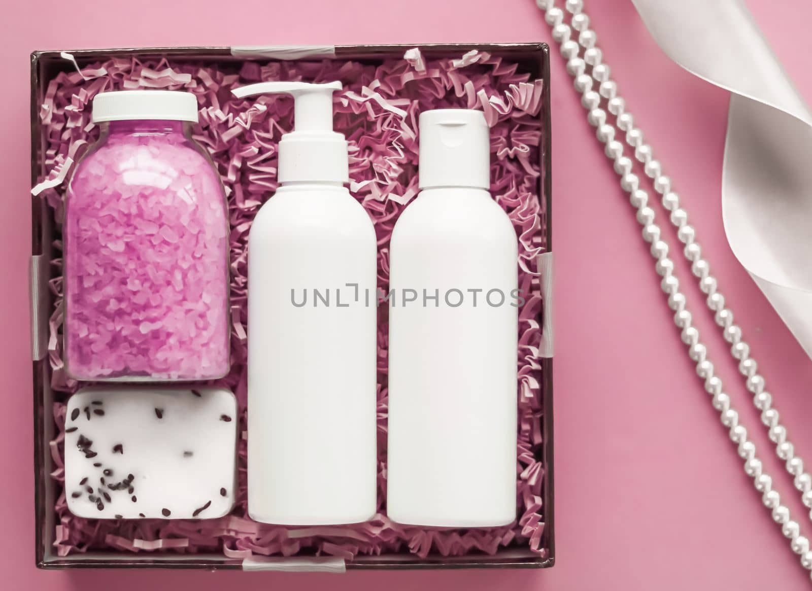 Beauty box subscription package, luxury skincare and body care products, milk lotion, bath salt, soap, shower gel as flat lay on pink background, spa cosmetics as holiday gift, online shopping delivery, flatlay by Anneleven