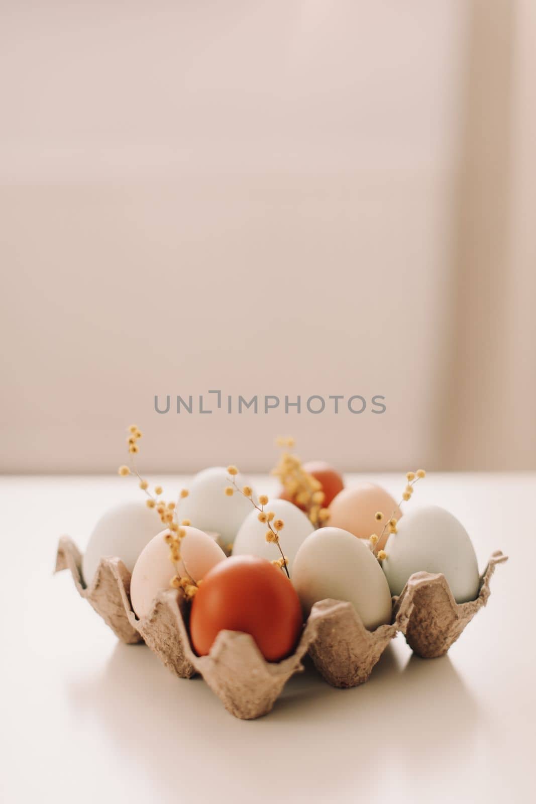 Chicken eggs of natural shades and colors on a white background. Healthy organic food, natural farmer's products concept. Happy Easter background. Selective focus.