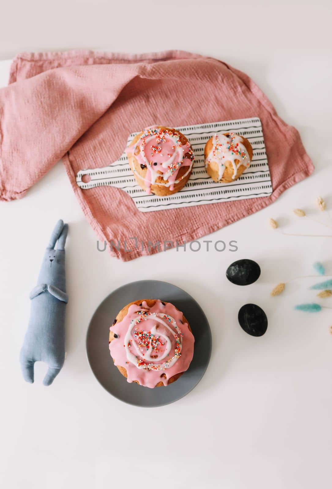 Easter cake, colorful eggs and rabbit toy. Happy Easter holiday concept. festive spring season