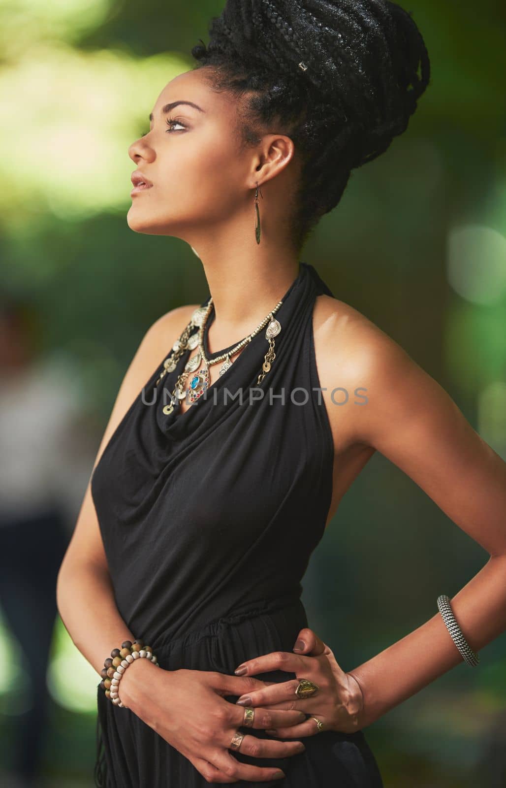 Spending time in the gorgeous outdoors. an attractive young woman posing outdoors. by YuriArcurs