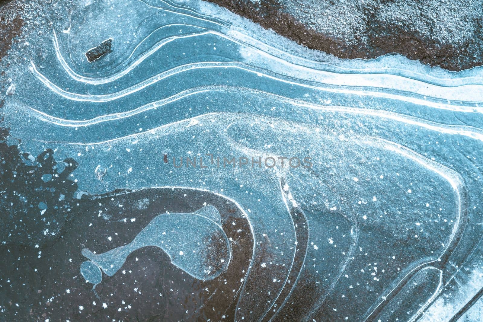 Blue ice formation with white curvy snow stripes and bulb-shaped ice formation that resembles whale. Minimalist design make this image perfect for backgrounds, wallpaper, or graphic design projects by LipikStockMedia
