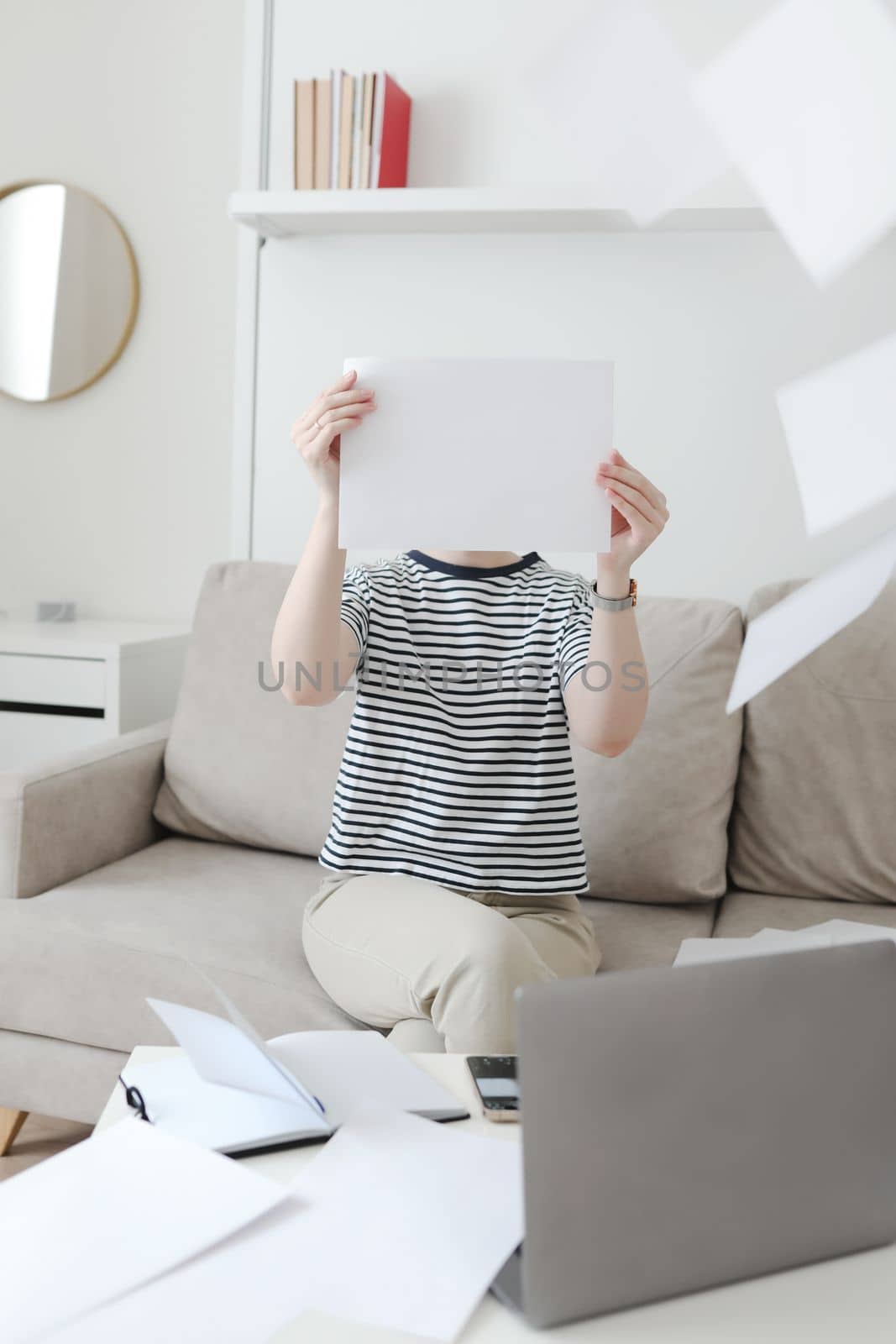 Creative photo of a busy business woman working with documents at workplace in a modern office. office manager or freelancer in a stylish room.