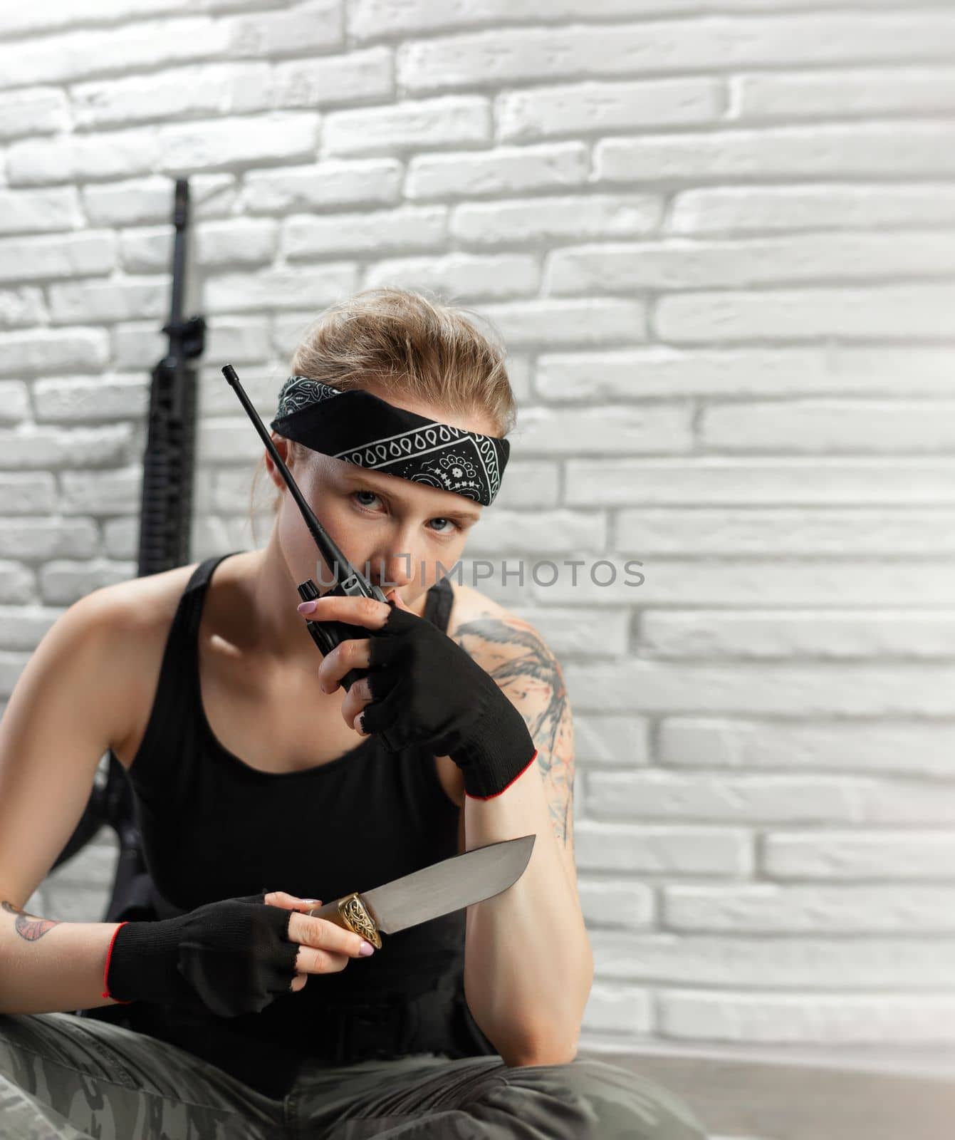 beautiful soldier girl with a walkie-talkie and a knife on a white background copy paste