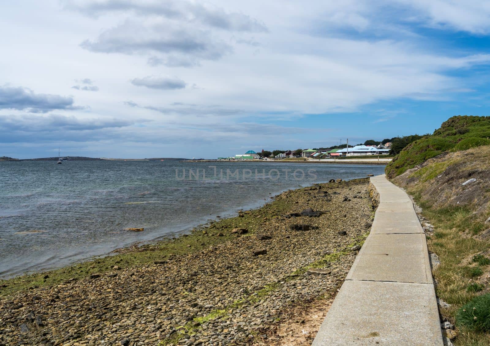 Concrete sea wall leading back to port of Stanley Falkland Islands