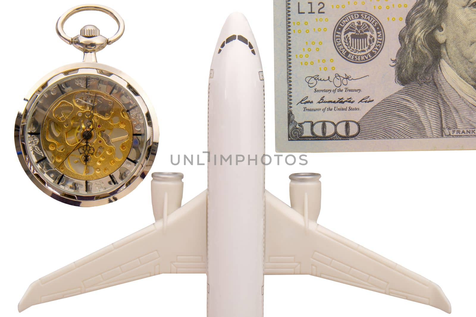 Close up of pocket watch, airplane, hundred dollar bill, travel takes time and money. Clipping paths. High quality photo