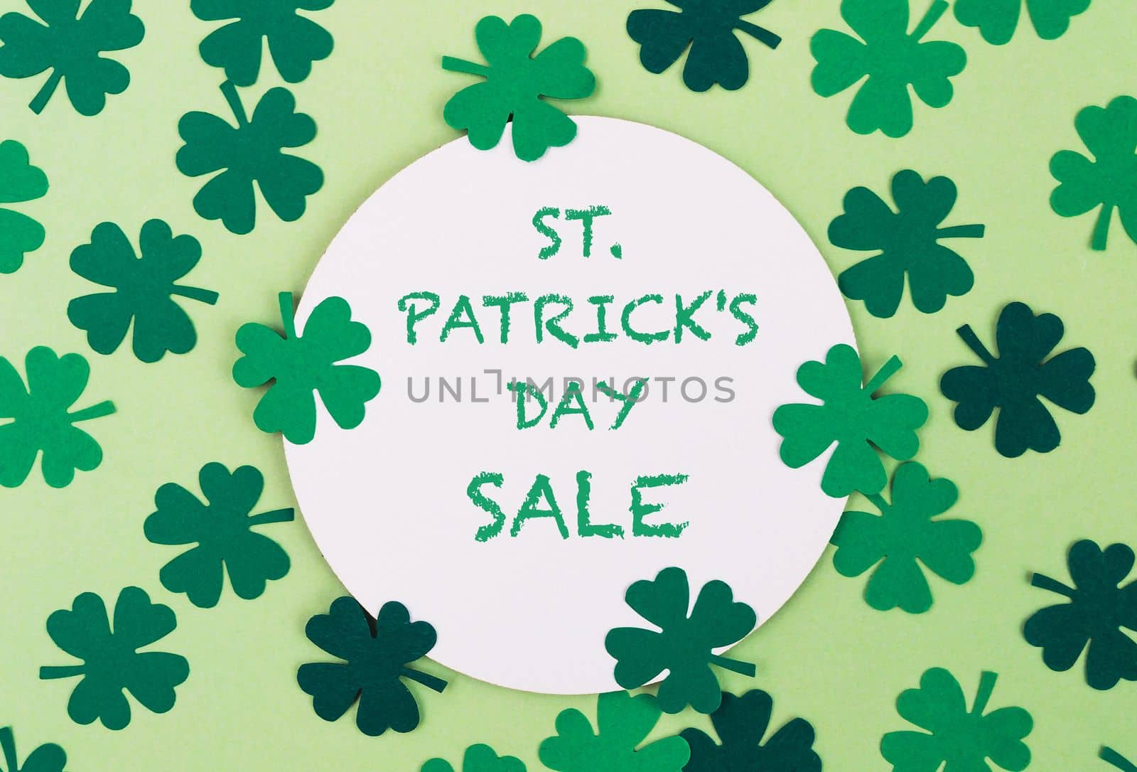 Sale on a green background for March 17 to St. Patrick's Day with green clovers. Template for design