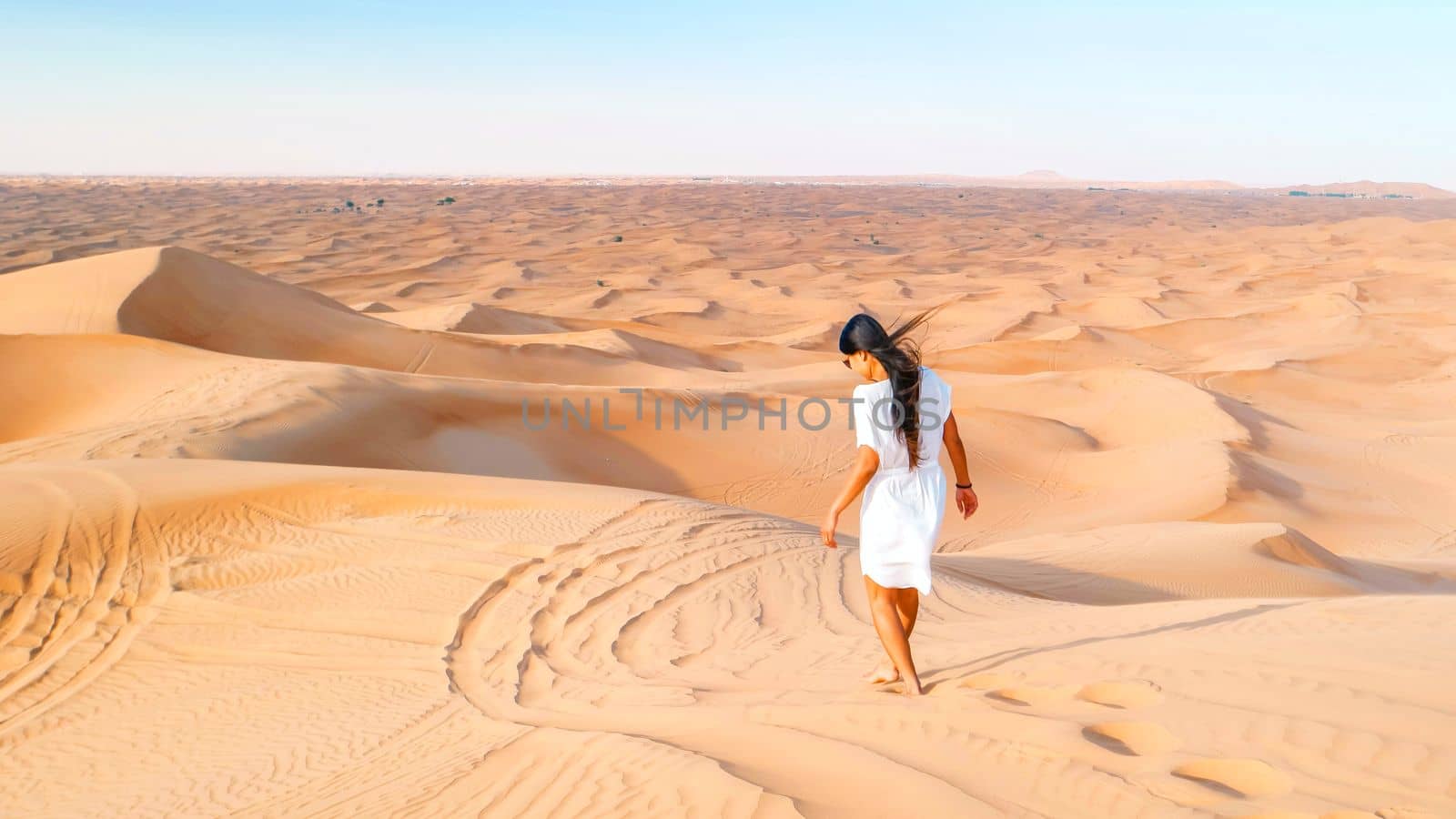 Dubai dessert sand dunes, Asian women on Dubai desert safari,United Arab Emirates by fokkebok