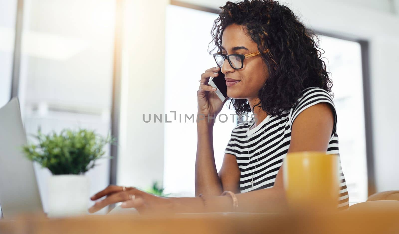 Communication and connectivity is her job today. a young woman working from home