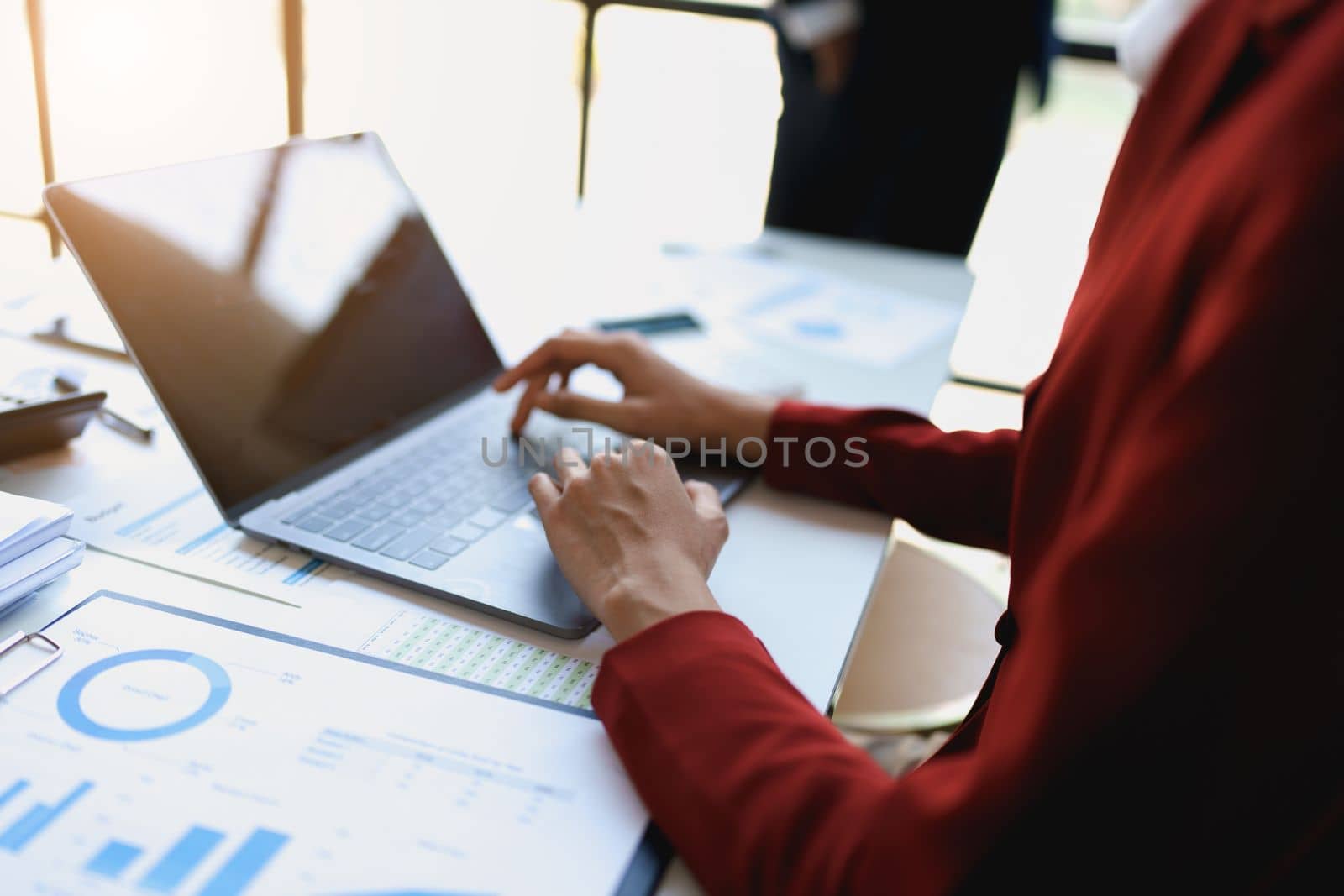 Team business adviser meeting to analyze and discuss the situation on the financial report n the meeting room with using computer laptop, documents, calculator in work