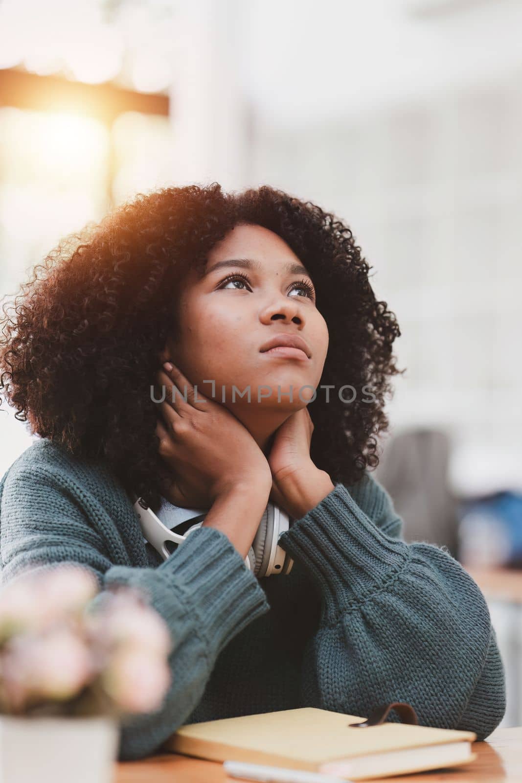 Portrait thoughtful confused young american african woman. Stress while studying online class. by itchaznong