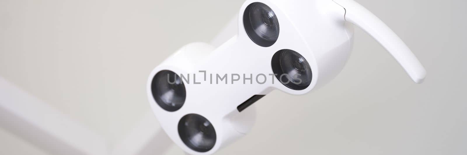 Black and white modern lamp in dental office. Services and equipment of the dental clinic