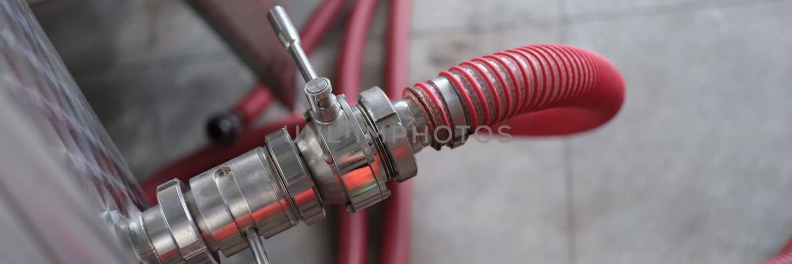 Industrial stainless steel pipe equipment with faucet and hose in wine production or chemical pharmaceutical production by kuprevich