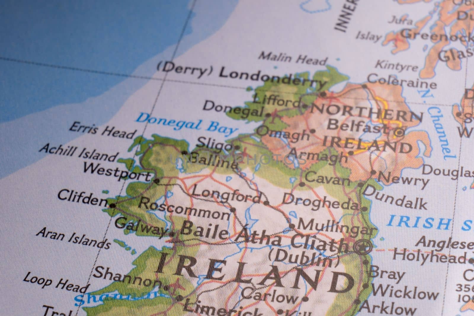 Close up of Ireland on detailed colorful map with selective focus, shallow depth of field, background blur. High quality photo