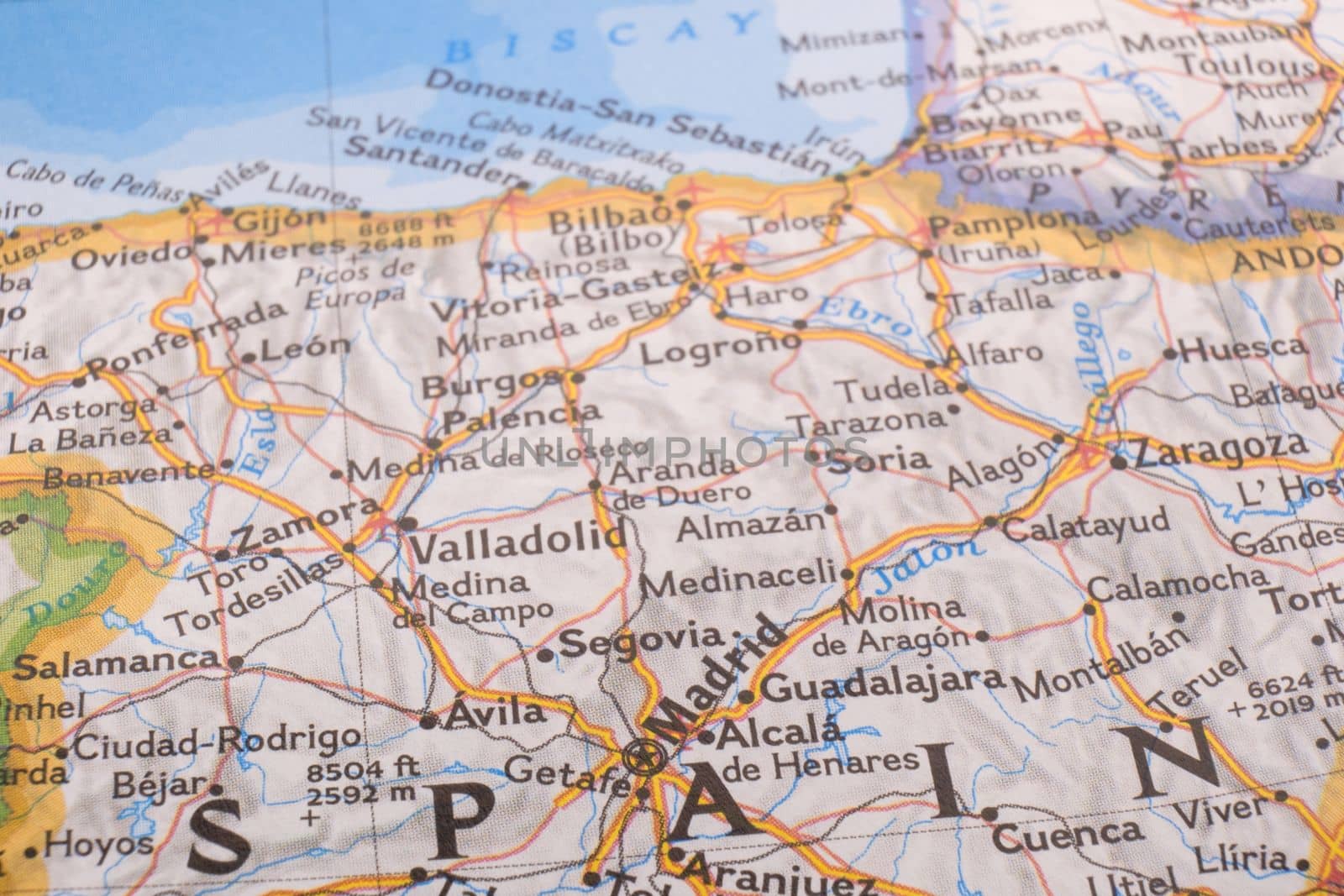 Close up detail of a colorful map highlighting Madrid, Spain through selective focus, background blur. High quality photo