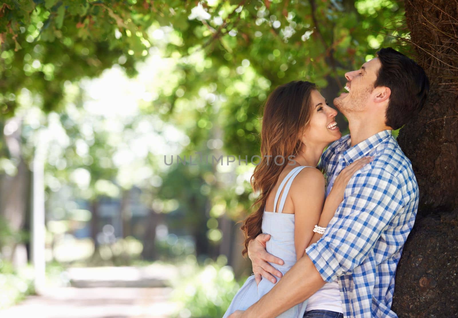 More than just a summer romance. A loving young couple standing in the summer sun
