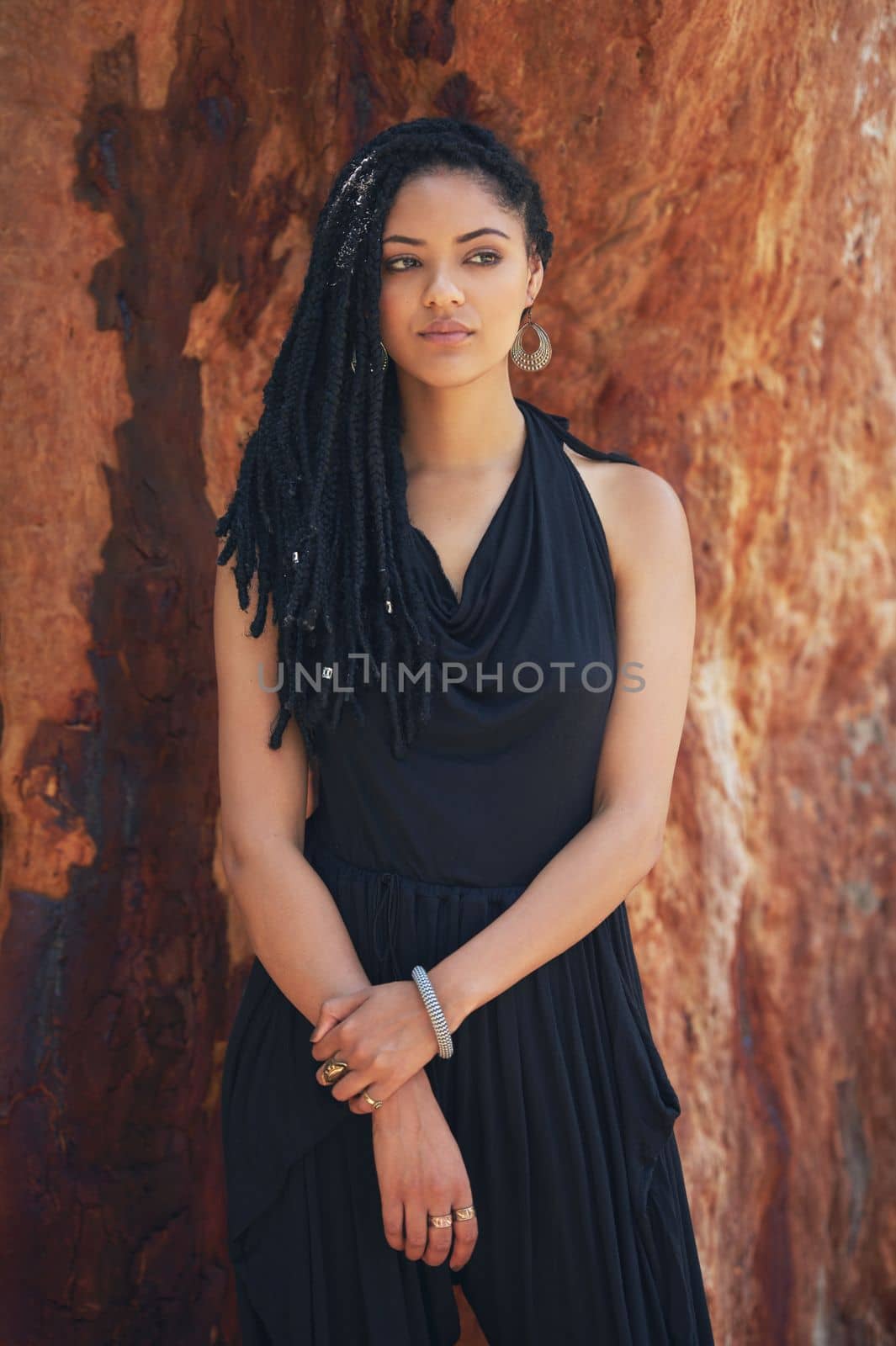 Her style is all natural. an attractive young woman posing outdoors. by YuriArcurs