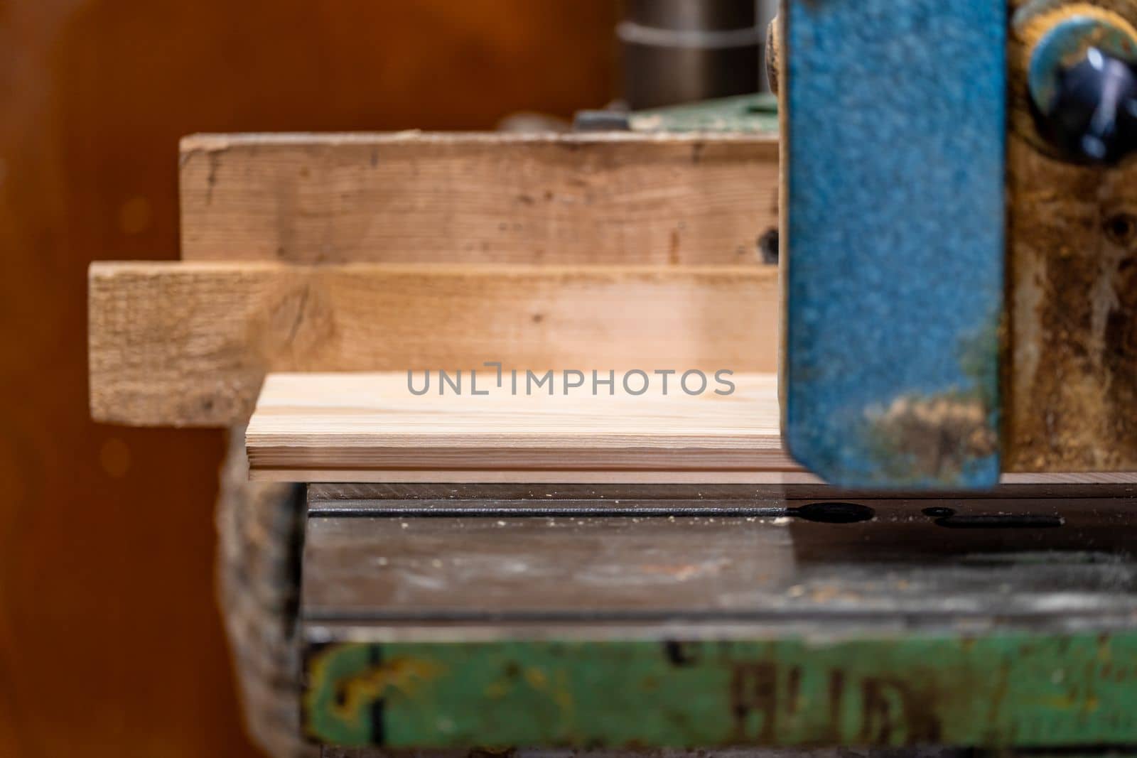 planing boards on a machine in a joinery. 