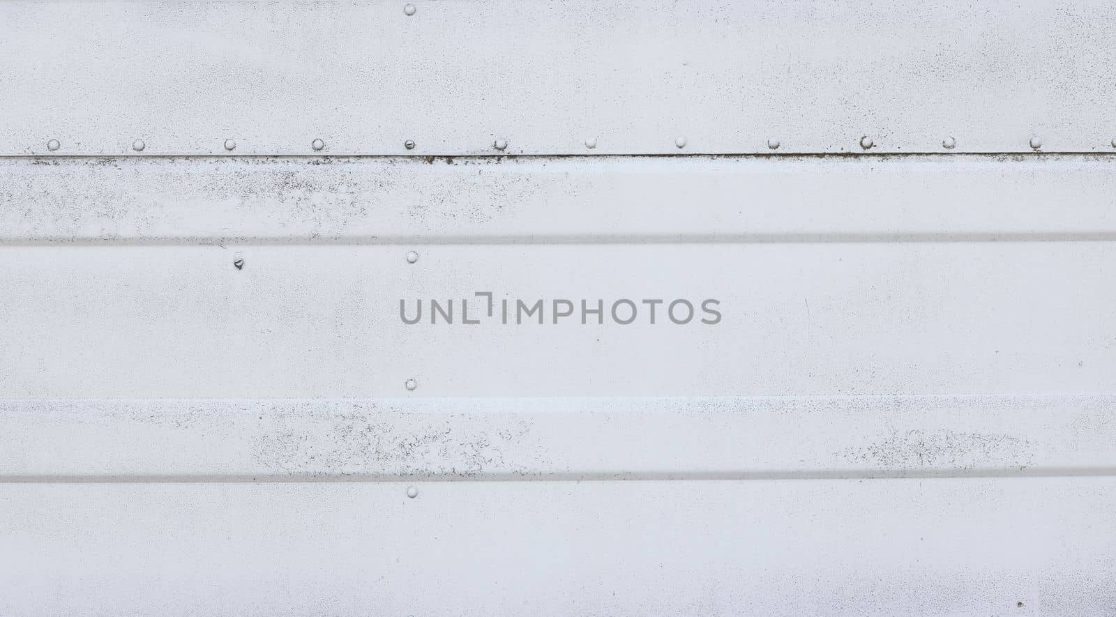 Grunge weathered white painted metal sheet wall or fence background texture