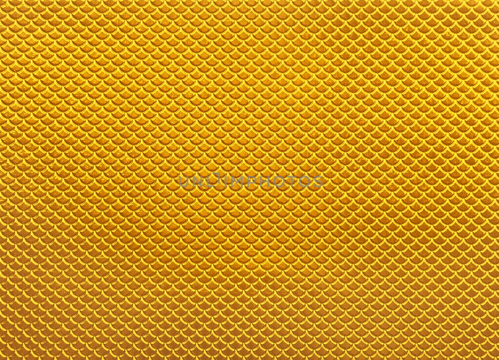 Abstract background of glossy shiny metallic vivid golden yellow scale shape pattern