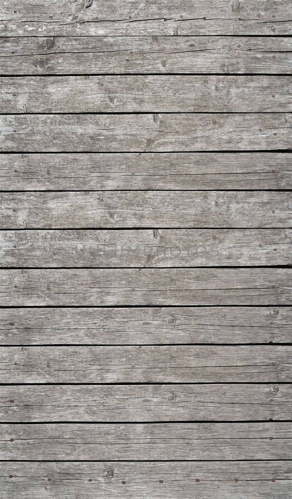 Old gray vintage rustic weathered wooden fence planks background