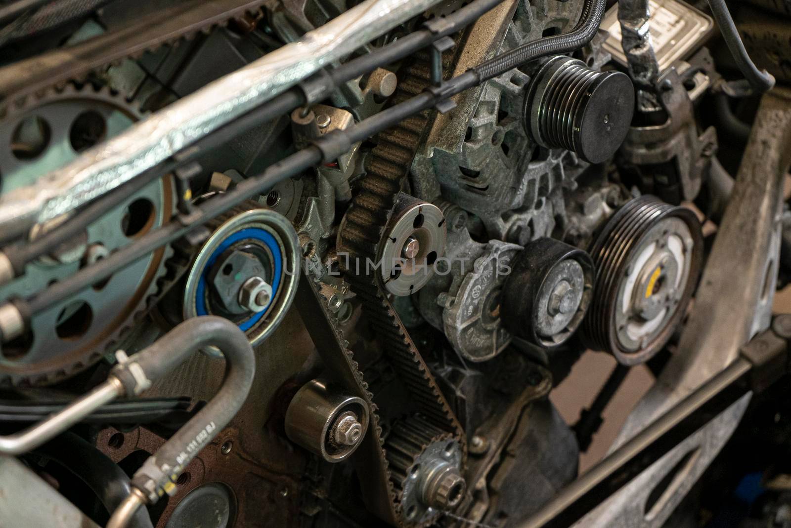 Detail of Car engine timing belt in a workshop