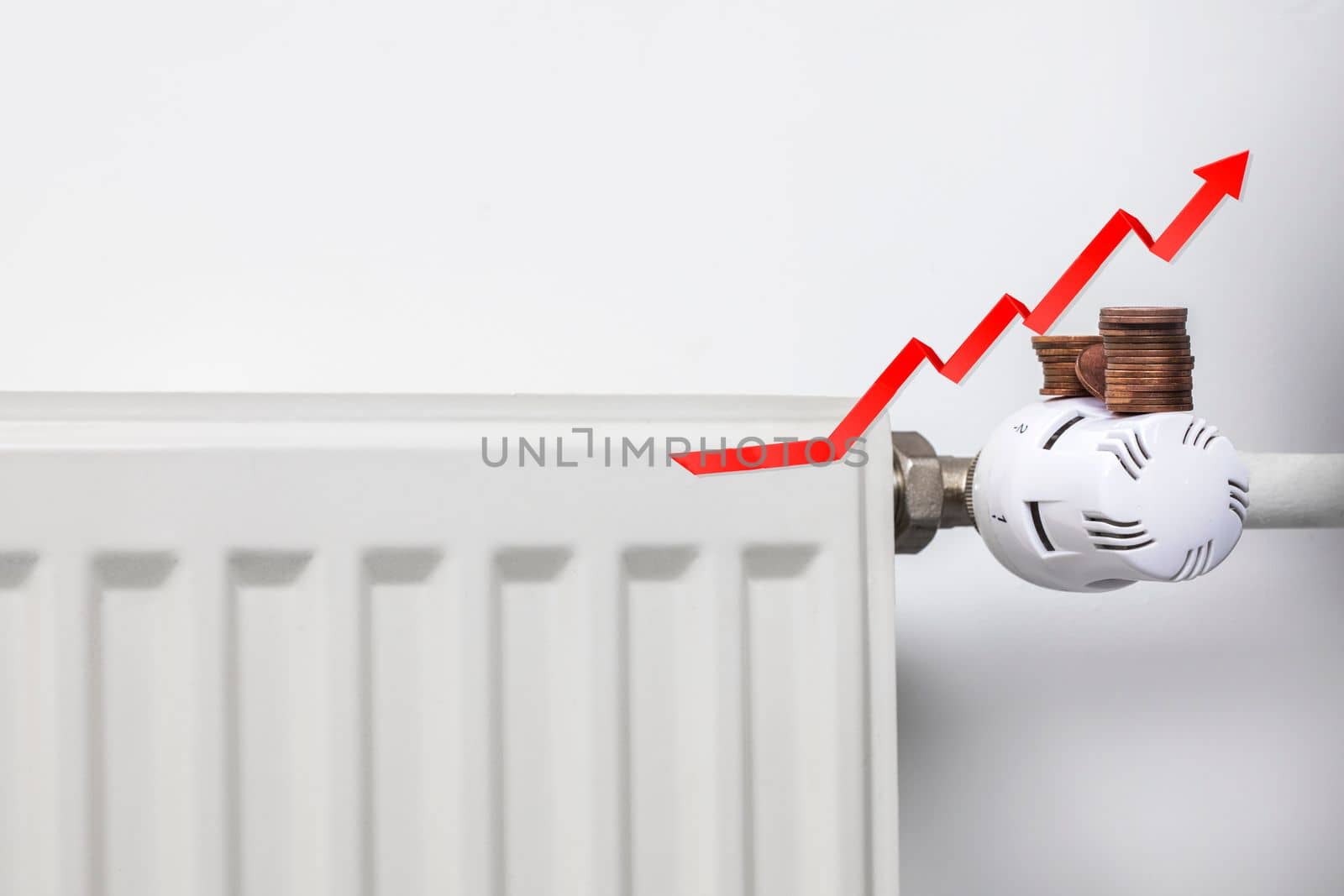 Increasing energy bills. Rising red arrow and coins on a heating radiator. Cost of living crisis. recession inflation concept copy space close up