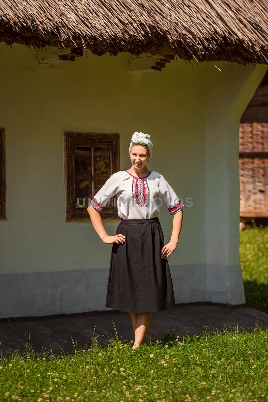 young woman in ukrainian national costume outdoors