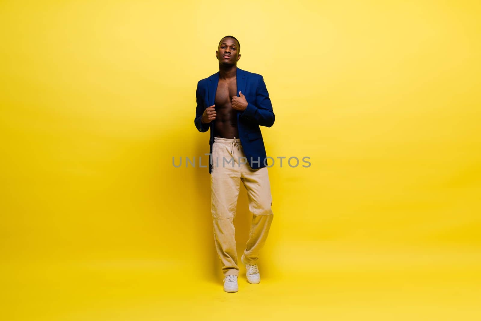 African American millennial businessman isolated on studio background, successful male formal suit by Zelenin