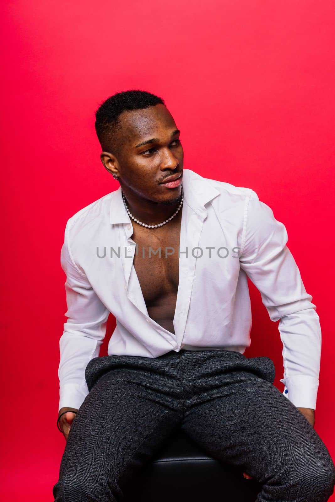 African American millennial businessman isolated on studio background, successful male formal suit by Zelenin