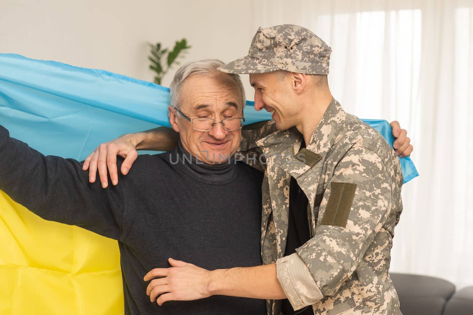 elderly father and son military flag of Ukraine by Andelov13