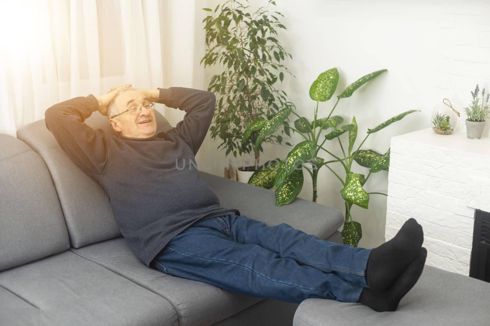 an elderly man is resting at home.